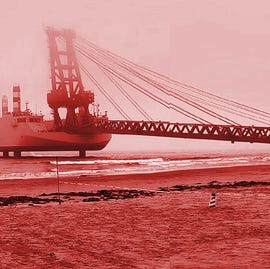 Chinese barges long ramps amphibious landing chinese barge with a long ramp leading onto the beach. other boats in the background connect to the barge in the foreground. all is presented with a red filter