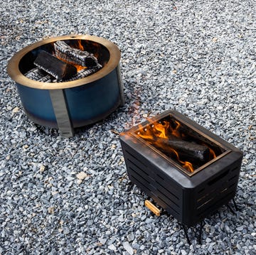 breeo, cuisinart, tiki firepits burning wood on gravel driveway breeo, cuisinart, tiki firepits burning wood on gravel driveway